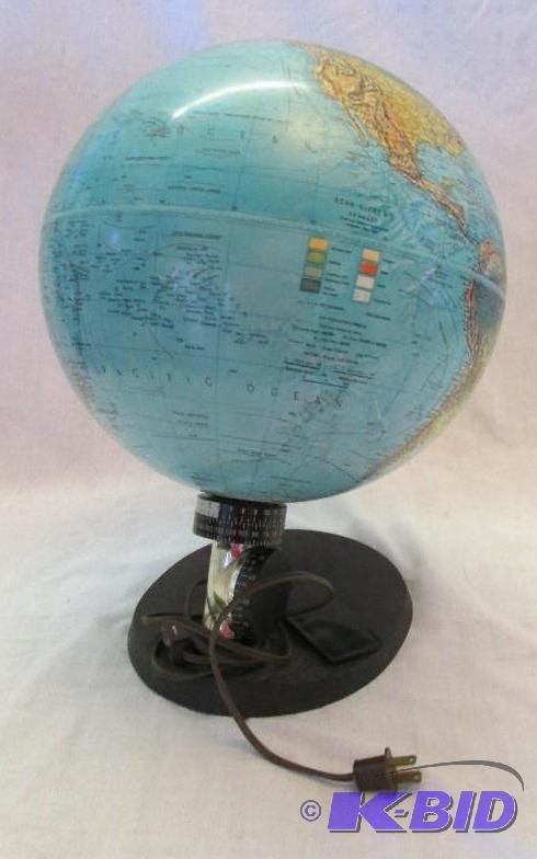 globe on wooden stand with plug in...