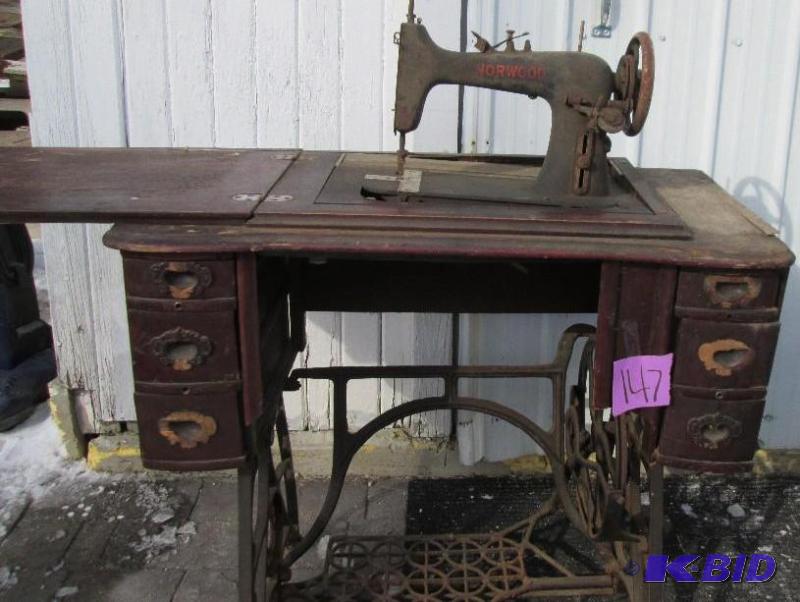 Norwood antique sewing machine on metal base....