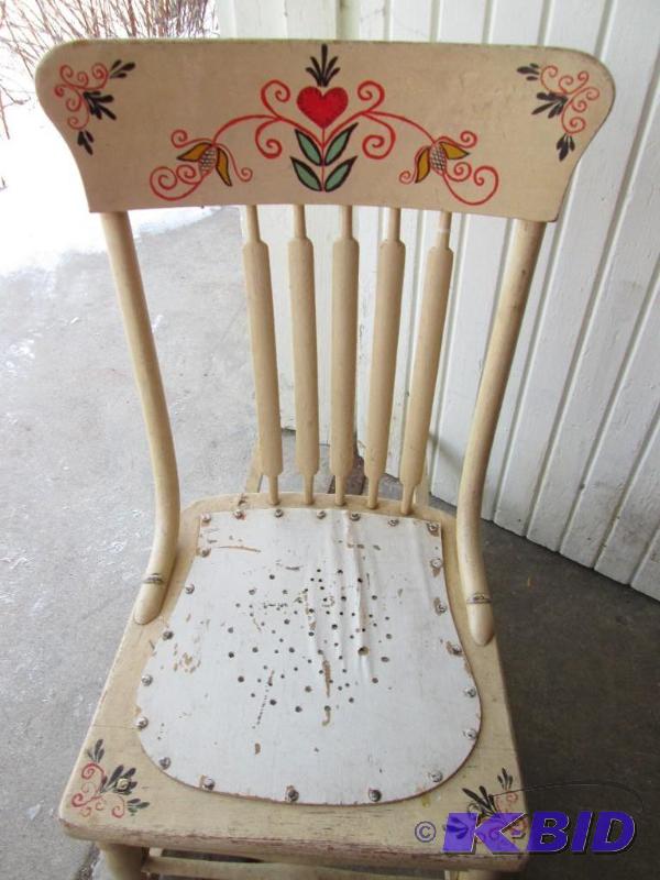 vintage rocking chair with floral designs pai...