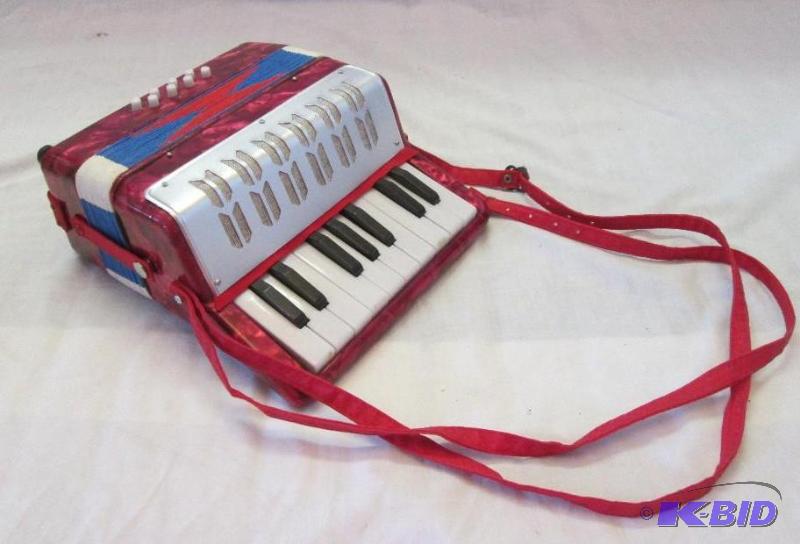 red acordian with handles...