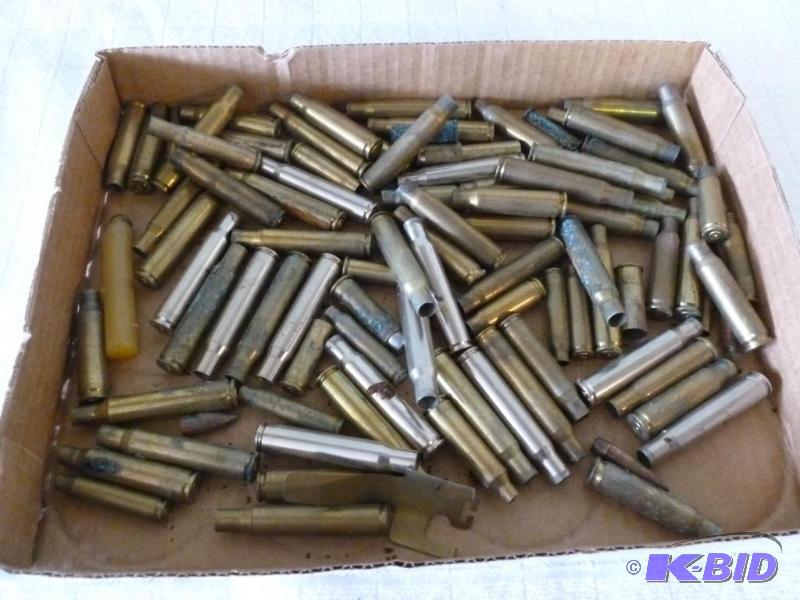 lot 49 image: Large lot of spent brass rifle casings....