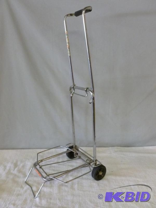 lot 56 image: American Tourister luggage cart....