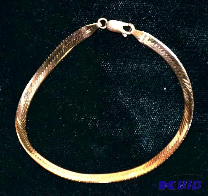lot 50 image: 14k GOLD wide bracelet...