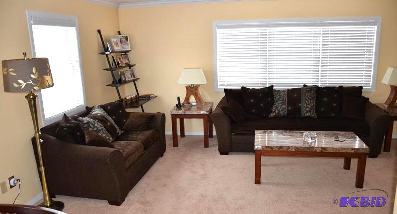 lot 75 image: Living room suite - Brown love seat & cou...