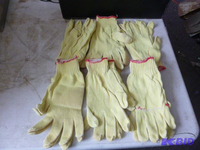 Six Pairs of One Size Fits All Gloves...