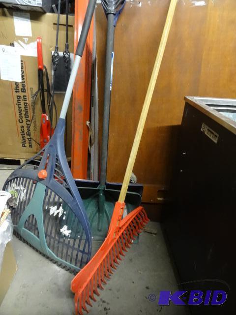 lot 12 image: 2 snow shovels. Lawn rake. Slap shot lawn hoc...