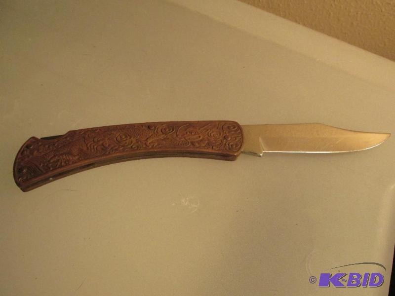 lot 201 image: Beautifully Embossed Pocket Knife