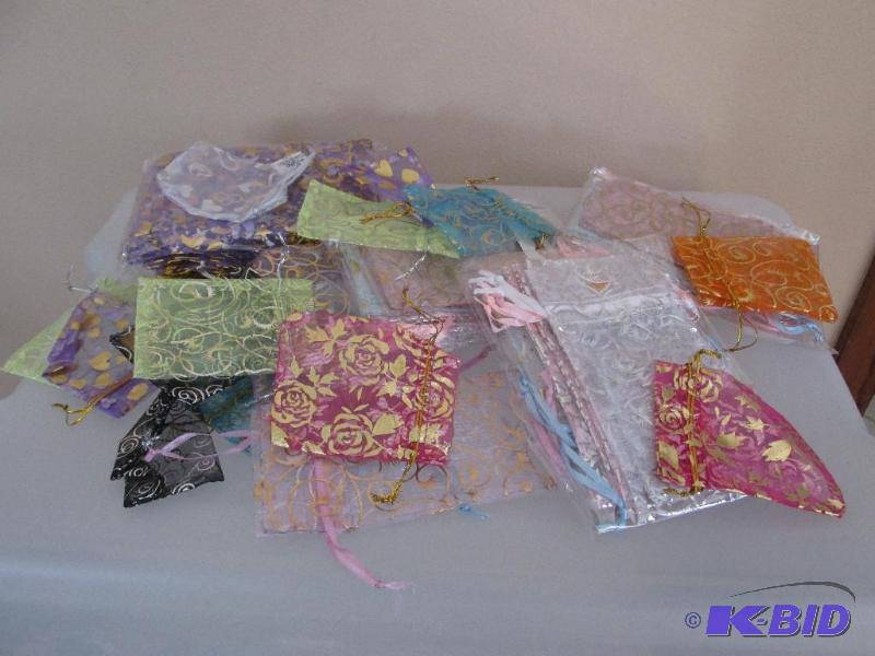 lot 234 image: Lots and Lots of Jewelry Bags in a Little Box