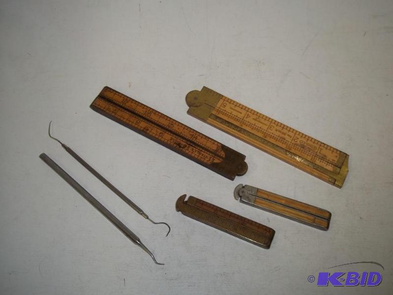 lot 66 image: Folding Rulers with dental picks...
