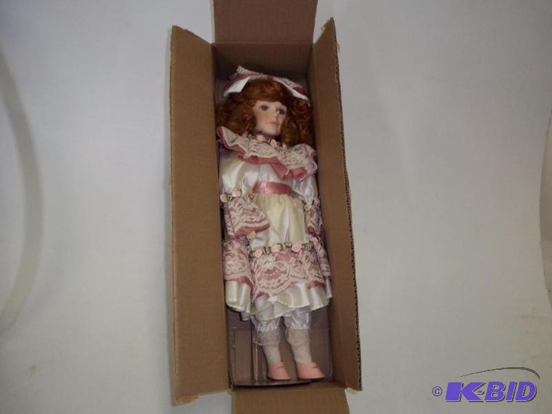 lot 91 image: 18" Porcelain doll with stand...