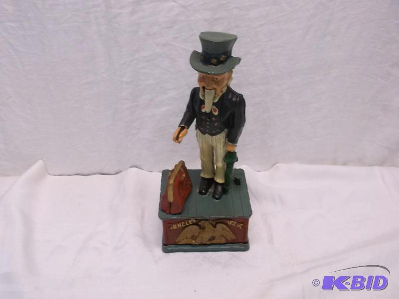 lot 51 image: Collectable cast iron Uncle Sam mechanical ba...