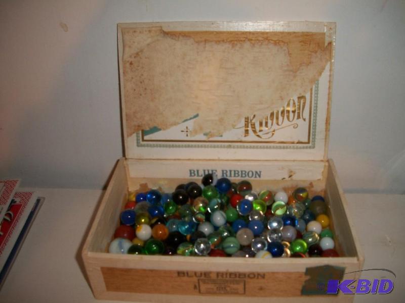 Cigar box filled with old marbles
