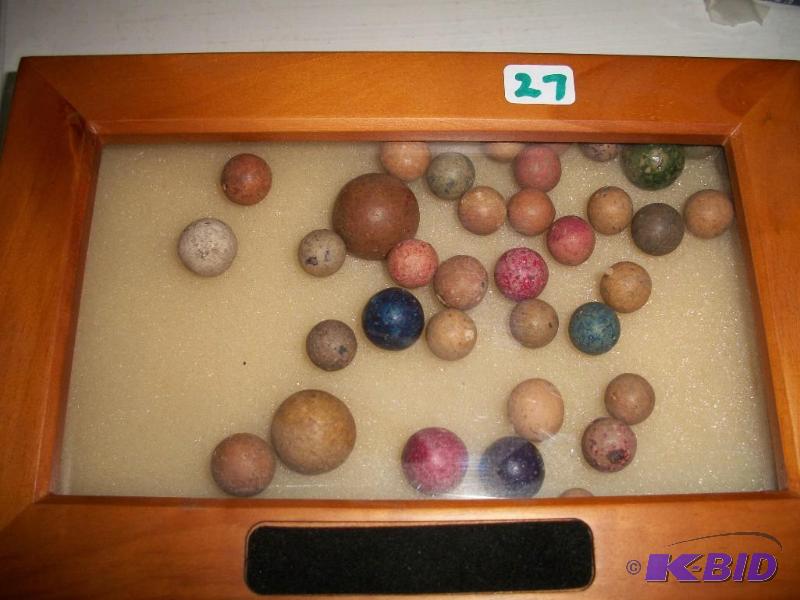 Antique clay marbles in display box