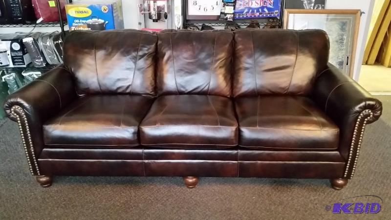 lot 1 image: New Beautiful Dark Antique Color DuraBlend Leather Sofa.  Full Size.