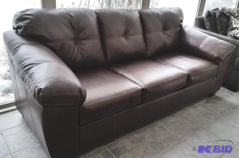 lot 3 image: New Ashley Full Size DuraBlend Deep Brown Leather Couch.  Matches Lot 4