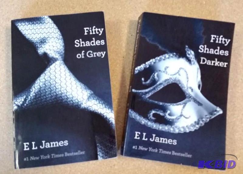 lot 34 image: Fifty Shades of Grey Paperback Book 1 and Fifty Shades Darker Paperback Book 2