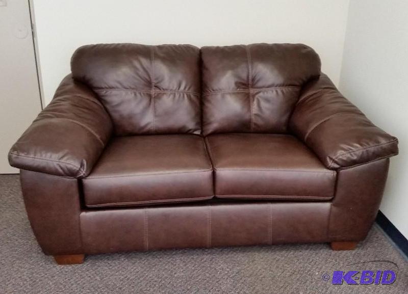lot 4 image: New Ashley Love Seat DuraBlend Deep Brown Leather Couch.  Matches Lot 3