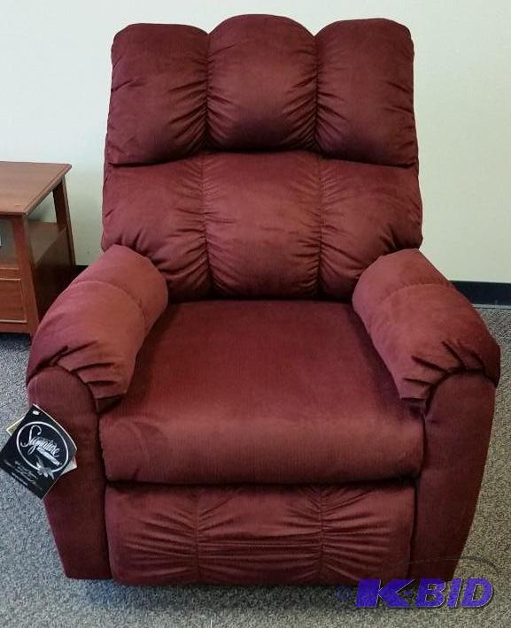 lot 6 image: Ashley Rocker Recliner.  New out of Box with Tags  Burgundy