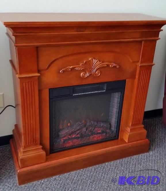 lot 8 image: McLeland Design Cherry Fireplace Mantel with Electric Heater  Heats very nicely.