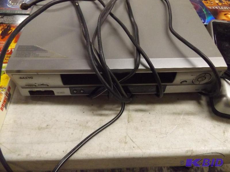 lot 13 image: Sanyo VCR and a Rewinder machine, with all th...