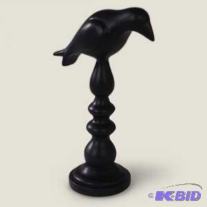Crow on stand figurine.