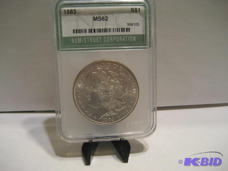 lot 1 image: 1883 UNCIRCULATED MORGAN SILVER DOLLAR SLABBED MS62 BY NTC 90% SILVER