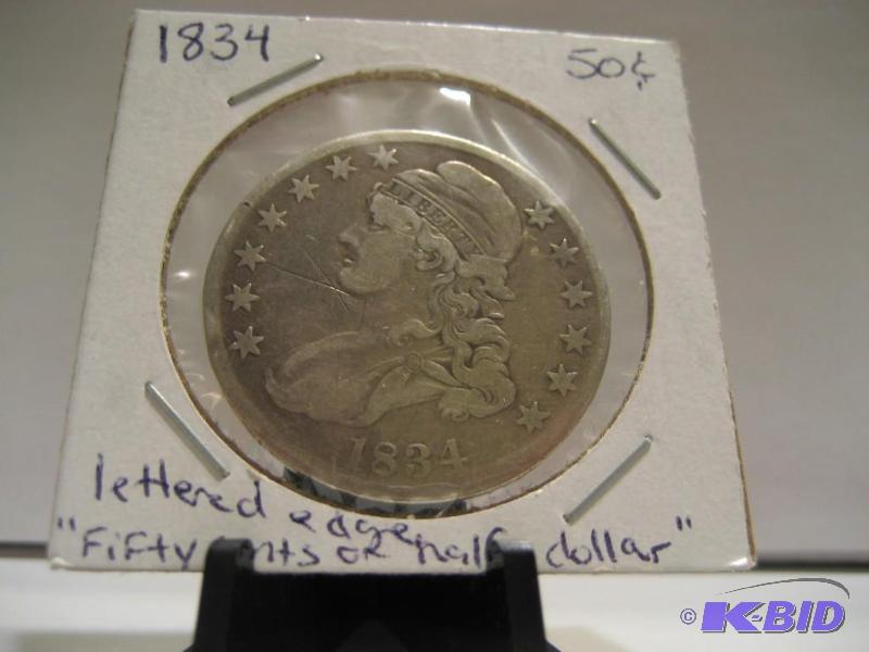 lot 15 image: 1834 BUST HALF DOLLAR LETTERED EDGE, EDGE READS FIFTY CENTS OR HALF A DOLLAR, 90% SILVER