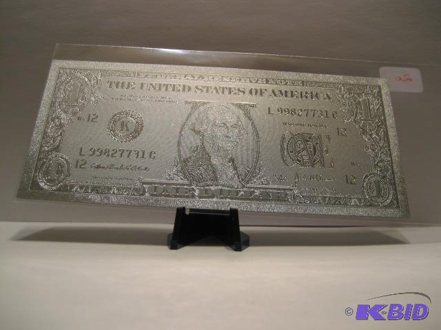 lot 20 image: 1 DOLLAR SILVER BILL, PURE .999 SILVER PRESSED ON TO A SPECIAL POLYCARBONATE TO MAKE THIS BILL