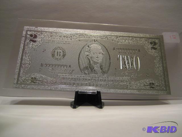 lot 21 image: 2 DOLLAR SILVER BILL, PURE .999 SILVER PRESSED ON TO A SPECIAL POLYCARBONATE TO MAKE THIS BILL