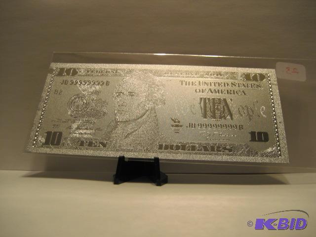 lot 23 image: 10 DOLLAR SILVER BILL, PURE .999 SILVER PRESSED ON TO A SPECIAL POLYCARBONATE TO MAKE THIS BILL