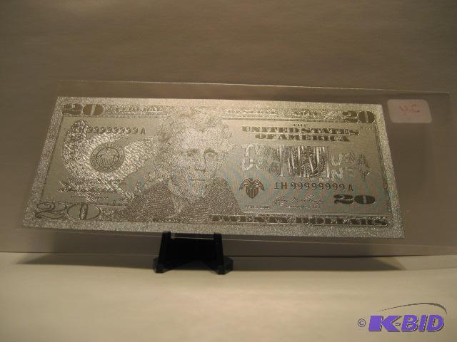 lot 24 image: 20 DOLLAR SILVER BILL, PURE .999 SILVER PRESSED ON TO A SPECIAL POLYCARBONATE TO MAKE THIS BILL
