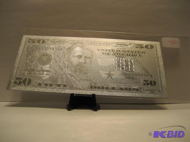 lot 25 image: 50 DOLLAR SILVER BILL, PURE .999 SILVER PRESSED ON TO A SPECIAL POLYCARBONATE TO MAKE THIS BILL