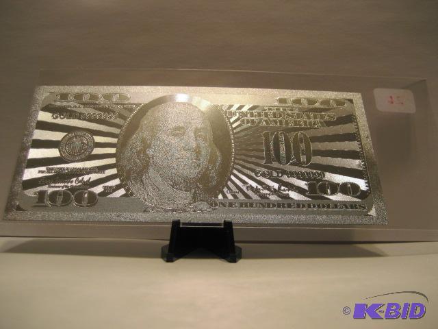 lot 26 image: 100 DOLLAR SILVER BILL, PURE .999 SILVER PRESSED ON TO A SPECIAL POLYCARBONATE TO MAKE THIS BILL
