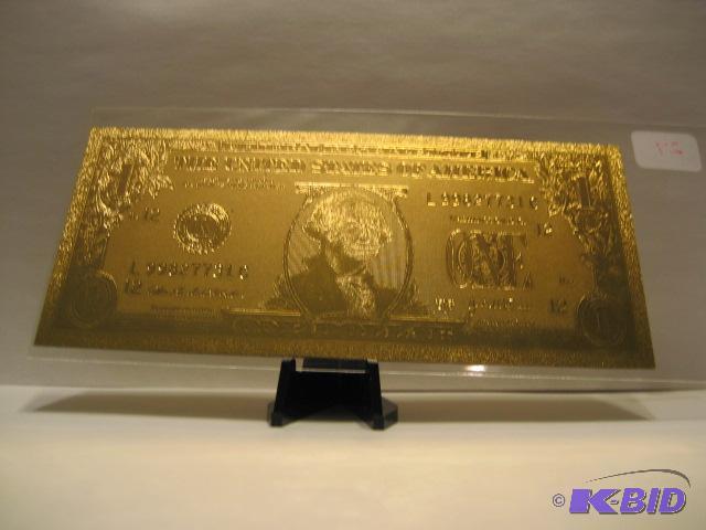lot 27 image: 1 DOLLAR GOLD BILL, PURE 24K GOLD PRESSED ON TO A SPECIAL POLYCARBONATE TO MAKE THIS BILL