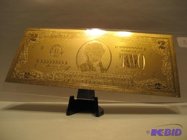 lot 28 image: 2 DOLLAR GOLD BILL, PURE 24K GOLD PRESSED ON TO A SPECIAL POLYCARBONATE TO MAKE THIS BILL