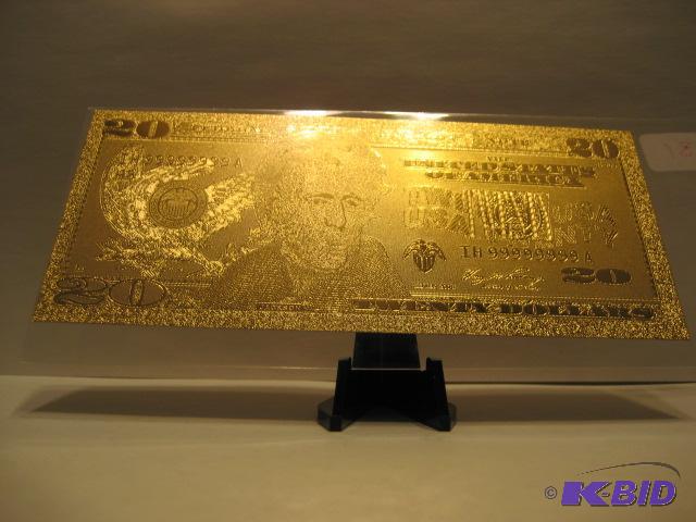 lot 31 image: 20 DOLLAR GOLD BILL, PURE 24K GOLD PRESSED ON TO A SPECIAL POLYCARBONATE TO MAKE THIS BILL