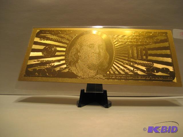 lot 33 image: 100 DOLLAR GOLD BILL, PURE 24K GOLD PRESSED ON TO A SPECIAL POLYCARBONATE TO MAKE THIS BILL