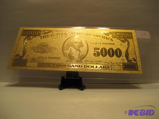 lot 36 image: 5000 DOLLAR GOLD BILL, PURE 24K GOLD PRESSED ON TO A SPECIAL POLYCARBONATE TO MAKE THIS BILLTHIS IS THE LAST OF THE LARGER DENOMINATION BILLS