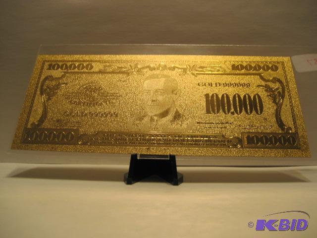 lot 38 image: 100,000 DOLLAR GOLD BILL, PURE 24K GOLD PRESSED ON TO A SPECIAL POLYCARBONATE TO MAKE THIS BILL THIS IS THE LAST OF THE LARGER DENOMINATION BILLS, NOT SURE IF THERE WILL BE NY MORE FOR SAL