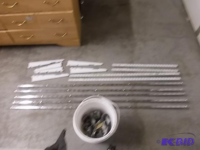 lot 22 image: 2-Wall Shelf Brackets, Bucket Of Casters...