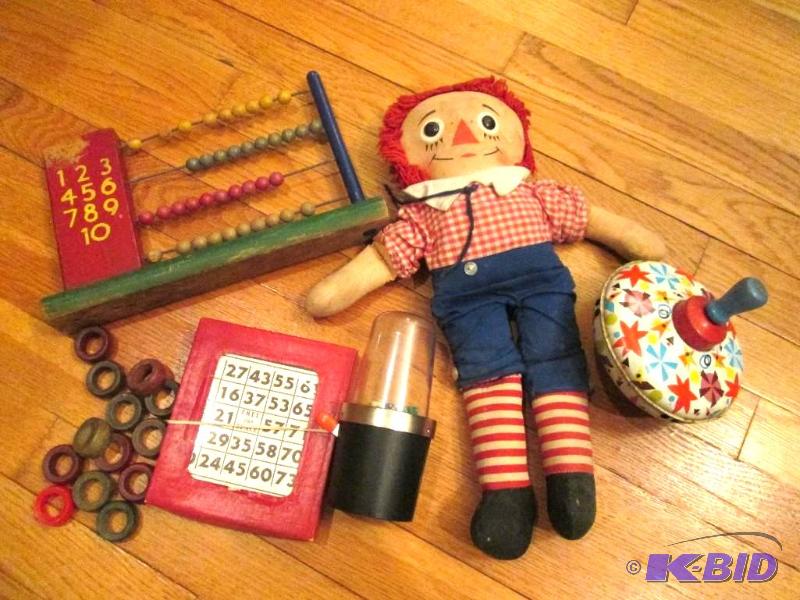 Assorted vintage toys, Raggedy Ann, a top, ab...