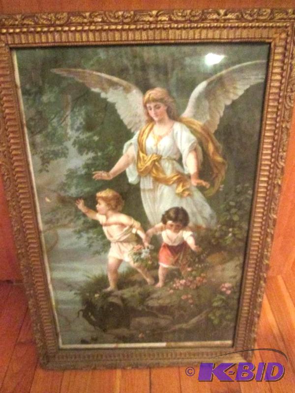 Angel scene in ornate frame 17 x 25...