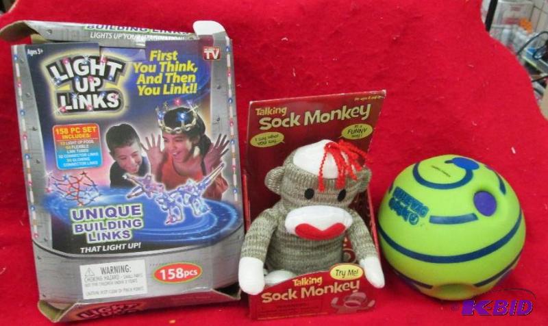 lot 192 image: Wobble Wag Giggle ball, Light up links, and t...