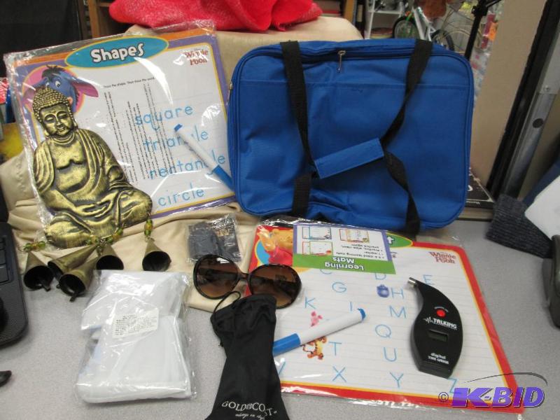 lot 218 image: Gold Cost sunglasses, Wind chime, Disney Winn...