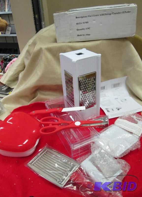 lot 22 image: 5 in 1 Grater with storage container and peel...