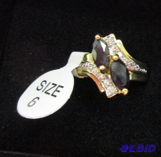 lot 57 image: size 6 ring with black stone...