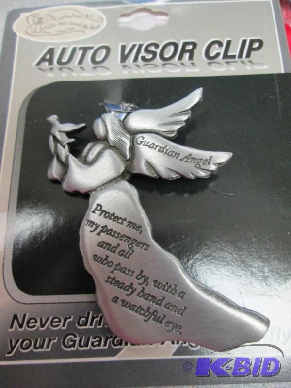 lot 59 image: Auto visor clip its a guardian Angel that has...