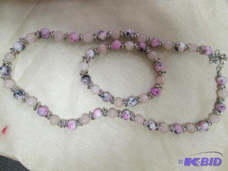 lot 79 image: Necklace and bracelet has black, pink, and wh...