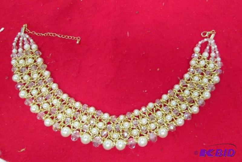 lot 83 image: Necklace with cream and clear beads with gold...