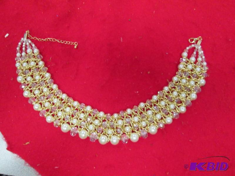 lot 84 image: Necklace with cream and clear beads with gold...